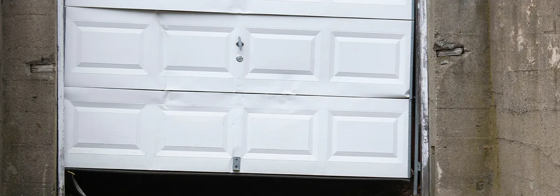 Garage Door Got Hit By A Car Dent Removal in Rock Island, IL